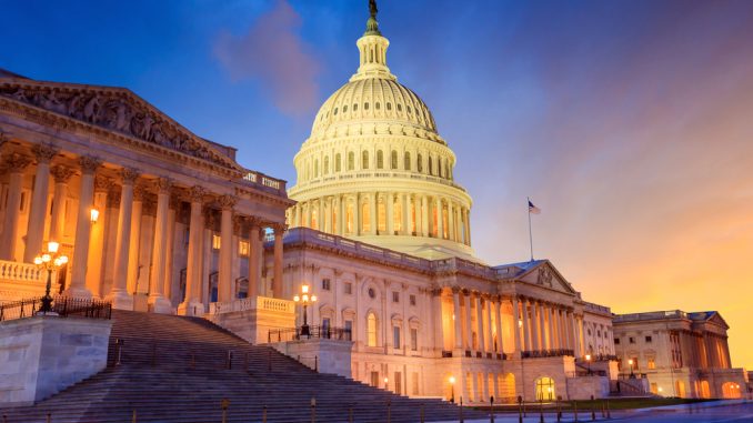 The,United,States,Capitol,Building,With,The,Dome,Lit,Up