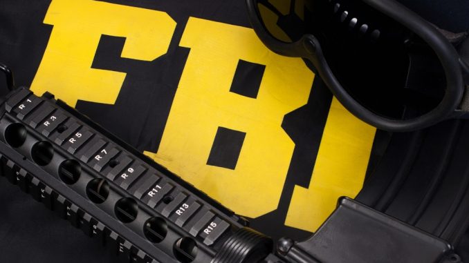 Assault,Rifle,And,Protective,Helm,With,Goggles,On,Fbi,Raid